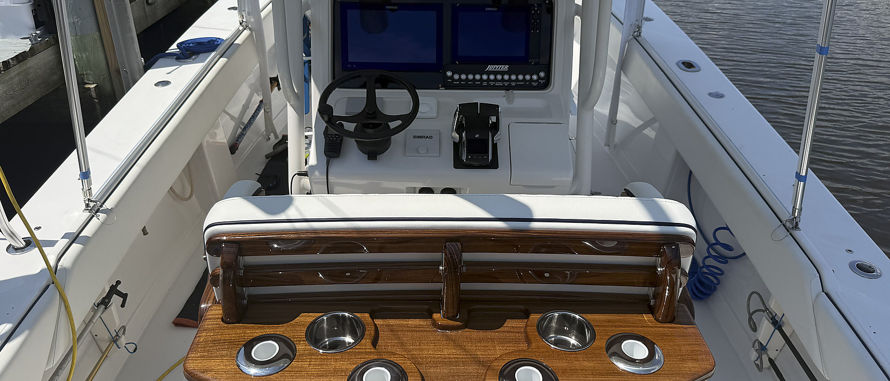 A finished helm with teak table on a boat Eastern Bay Boat Works rigged