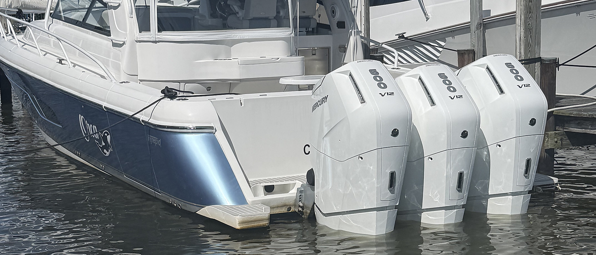 A sportfishing boat running off Ocean City on quad Mercury outboards
