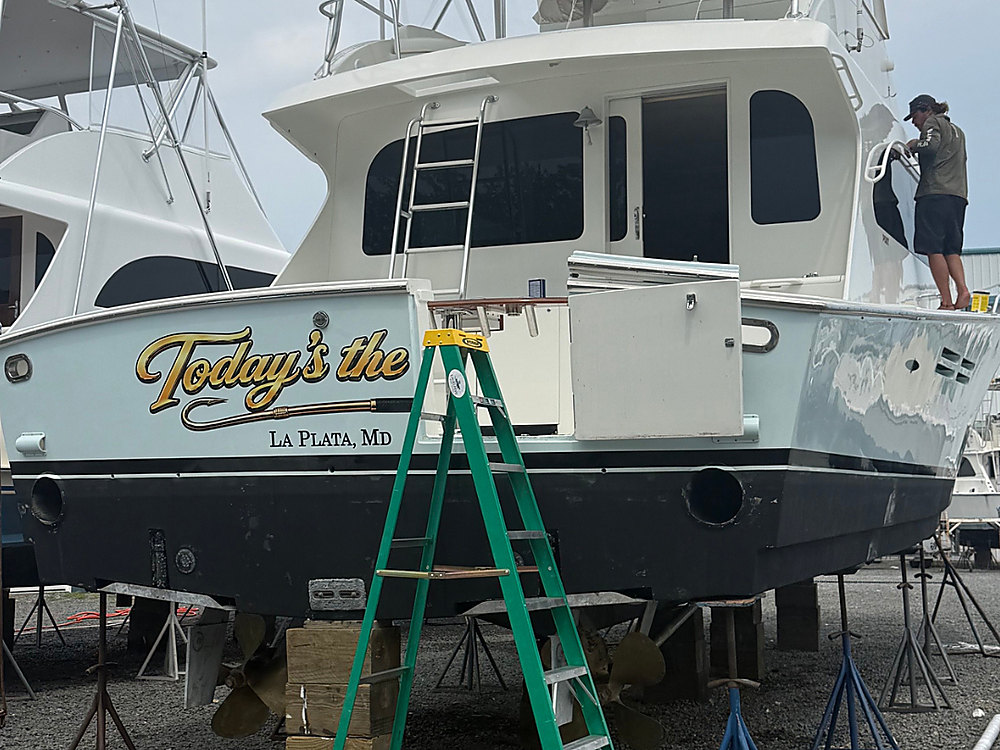 New transom lettering on a sportfishing boat in the yard before its rigging work