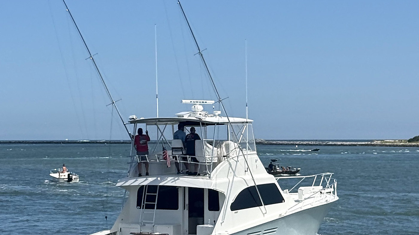 A sportfishing boat running offshore after a rigging refit by Eastern Bay Boat Works