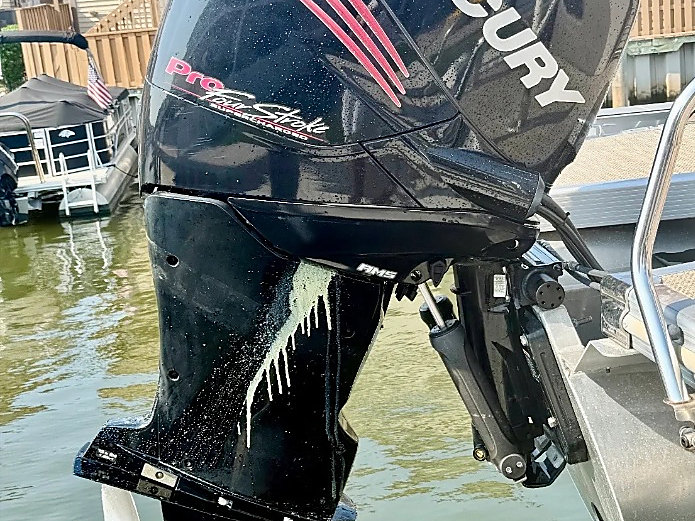 The original outboard on the transom before the Mercury repower