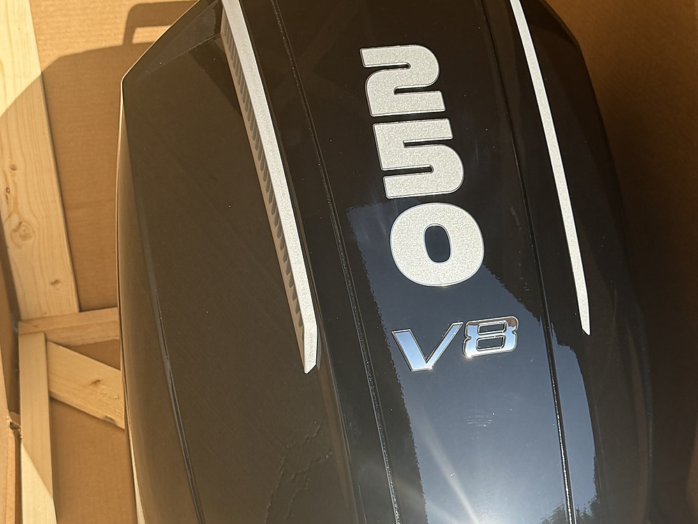 The cowl of a new Mercury 250 V8 outboard inside its shipping crate
