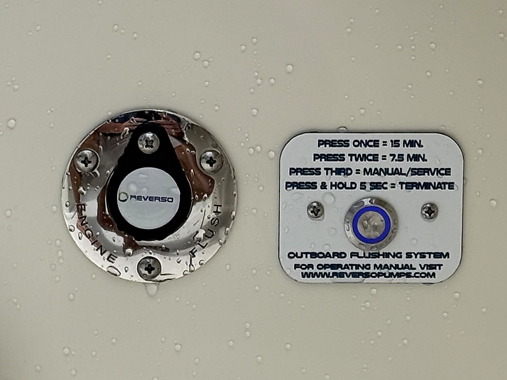 The Reverso deck plate beside its placard explaining the flushing cycle