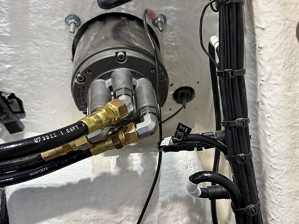 Hydraulic hoses tied into a boat's existing steering system