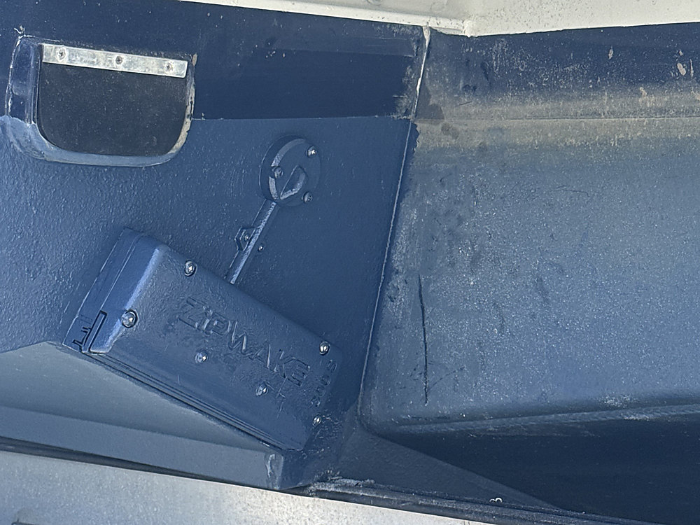Close up of a Zipwake interceptor and its wiring under the hull